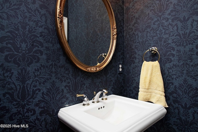 906 Taberna Cir, New Bern, NC 28562 - bathroom featuring wallpapered walls and a sink