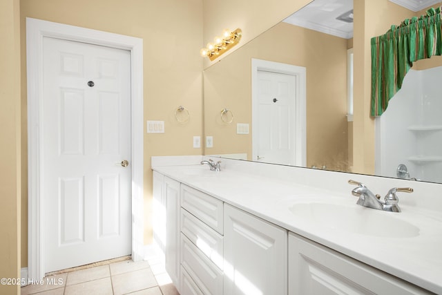 906 Taberna Cir, New Bern, NC 28562 - bathroom featuring a sink, double vanity, tile patterned floors, and crown molding