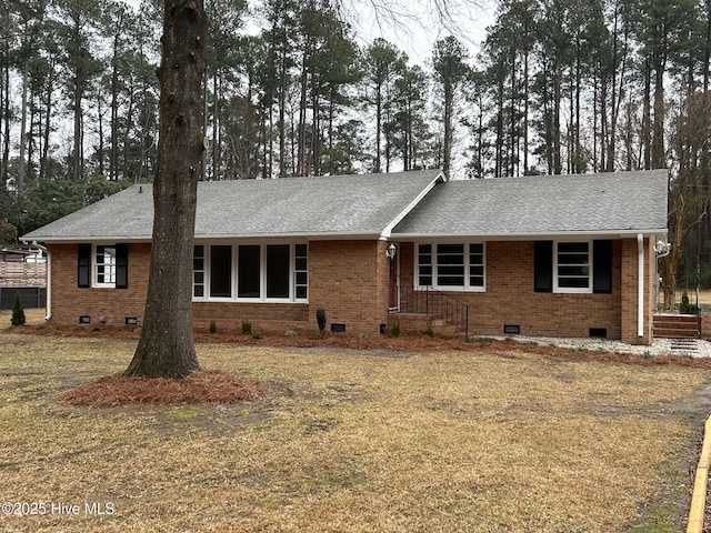 ranch-style house with a shingled roof, crawl space, and brick siding