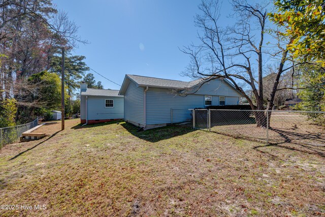 137 El Ogden Dr, Wilmington, NC 28411 - back of house with a yard, crawl space, a chimney, and a fenced backyard