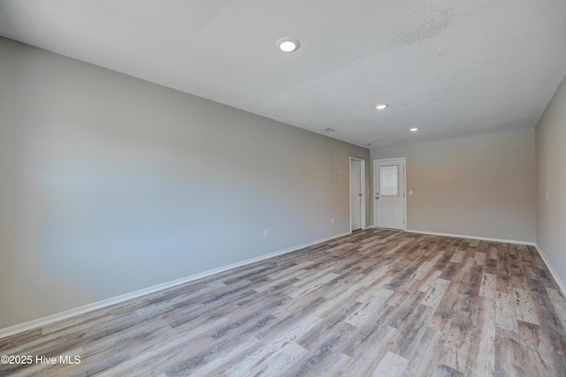 137 El Ogden Dr, Wilmington, NC 28411 - empty room with a textured ceiling, recessed lighting, wood finished floors, and baseboards