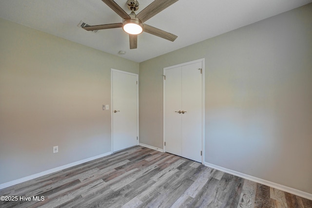 137 El Ogden Dr, Wilmington, NC 28411 - unfurnished bedroom with ceiling fan, baseboards, and wood finished floors