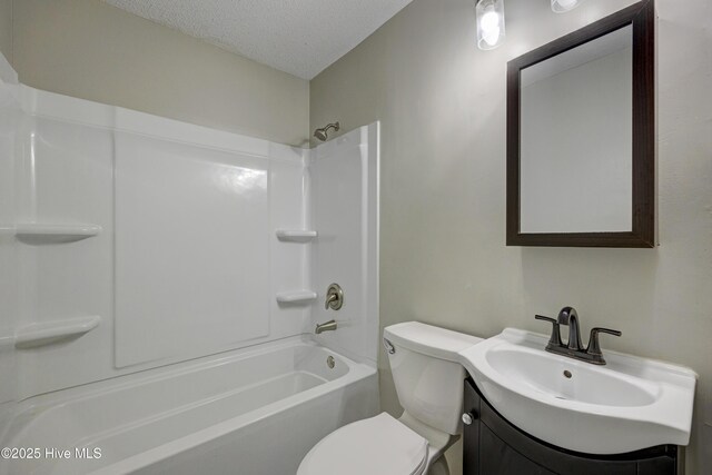 137 El Ogden Dr, Wilmington, NC 28411 - full bathroom with toilet, shower / bathtub combination, a textured ceiling, and vanity