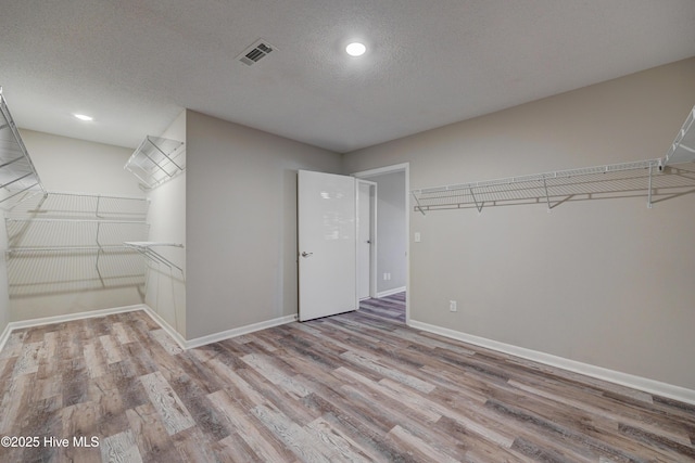 137 El Ogden Dr, Wilmington, NC 28411 - spacious closet with visible vents and wood finished floors