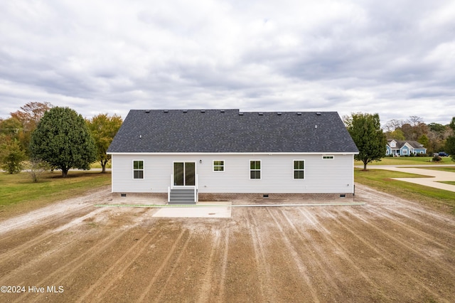 back of property featuring crawl space, entry steps, and roof with shingles