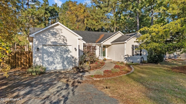 single story home featuring a front lawn, crawl space, driveway, and an attached garage