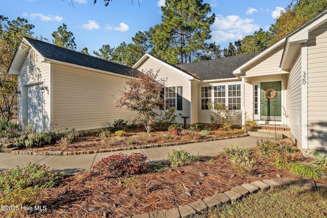 view of front of house with a shingled roof