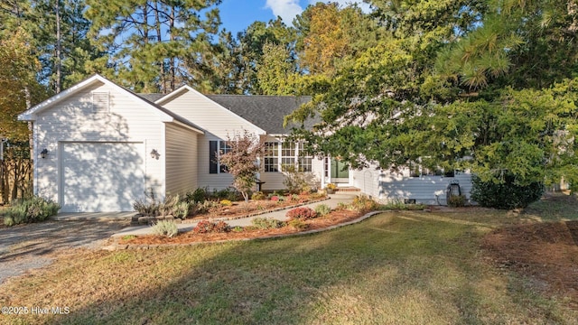 ranch-style house with driveway, crawl space, an attached garage, and a front yard