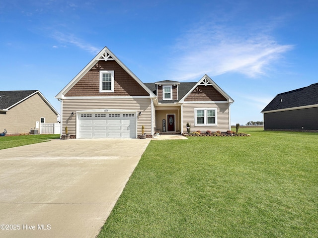 craftsman house featuring a garage, driveway, and a front lawn