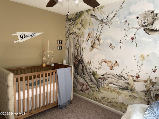 carpeted bedroom featuring ceiling fan and baseboards