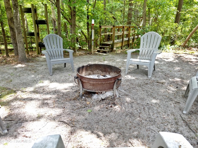 view of patio with a fire pit