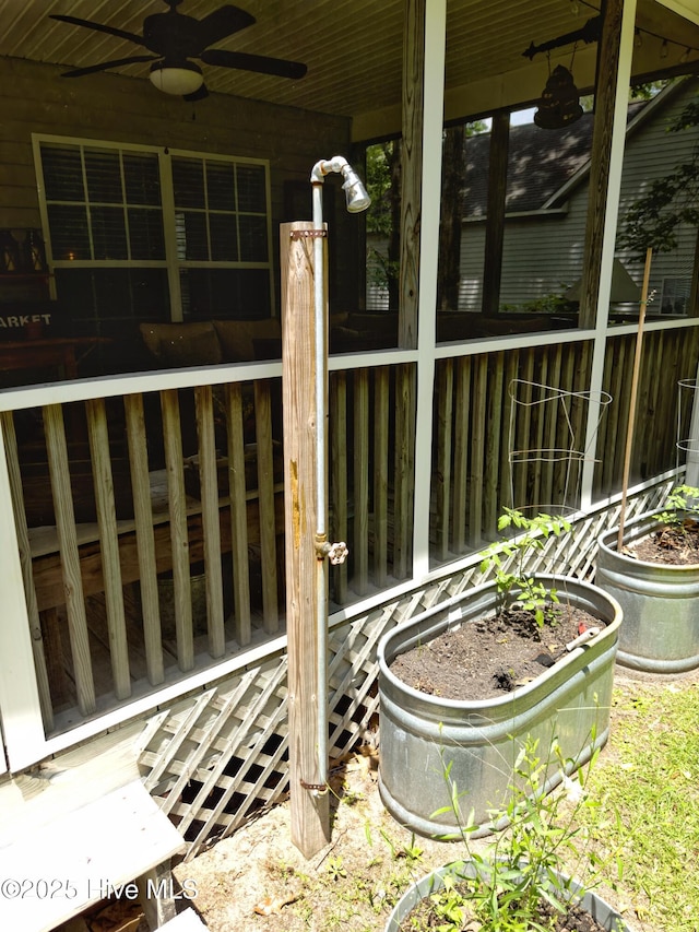 exterior space featuring ceiling fan