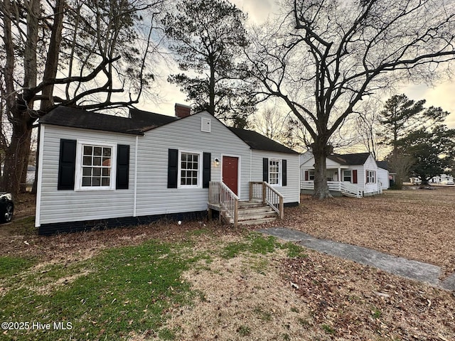 view of front of property with a chimney