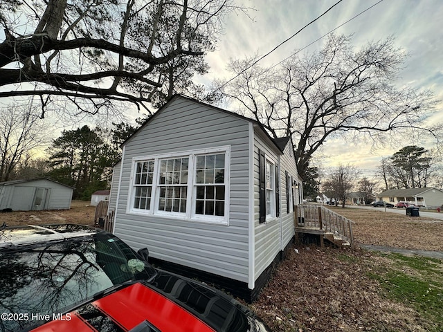 view of side of property with an outbuilding