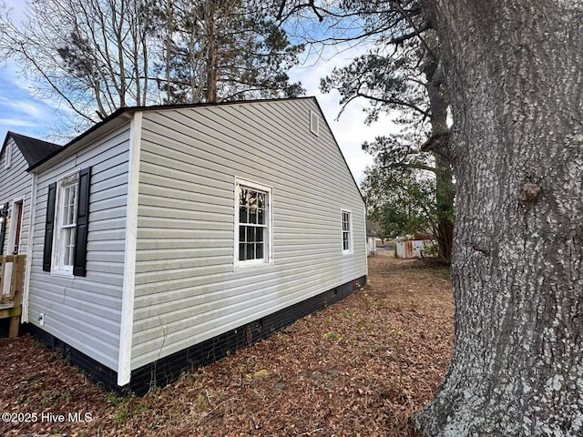 view of side of home with crawl space