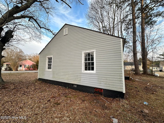 view of side of property featuring crawl space