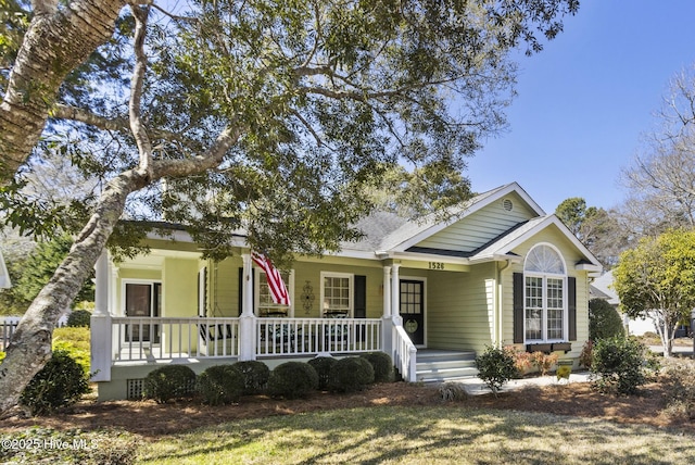 ranch-style home with covered porch