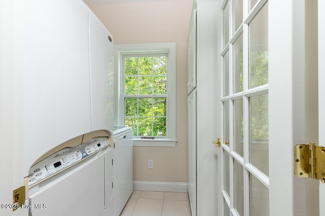 917 Hearthside Ct, New Bern, NC 28560 - laundry room featuring washing machine and dryer, light tile patterned flooring, and baseboards