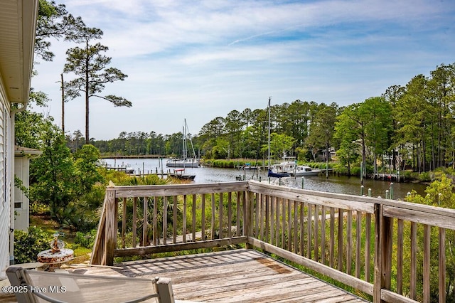 917 Hearthside Ct, New Bern, NC 28560 - wooden deck with a water view, a boat dock, and view of scattered trees