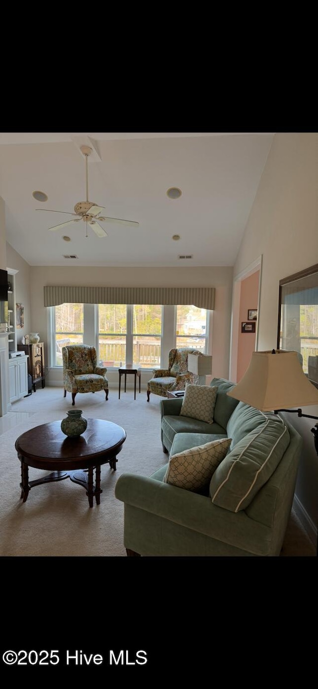 917 Hearthside Ct, New Bern, NC 28560 - living room featuring lofted ceiling, light colored carpet, and a ceiling fan