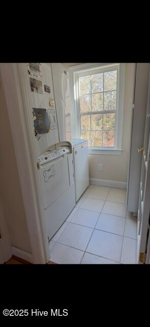 917 Hearthside Ct, New Bern, NC 28560 - washroom with washing machine and clothes dryer, light tile patterned floors, and baseboards