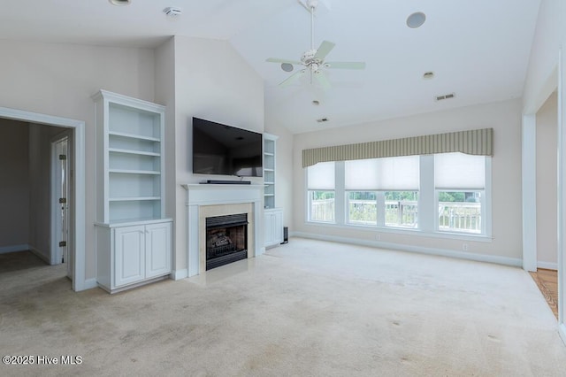 917 Hearthside Ct, New Bern, NC 28560 - unfurnished living room featuring carpet floors, plenty of natural light, ceiling fan, a premium fireplace, and high vaulted ceiling