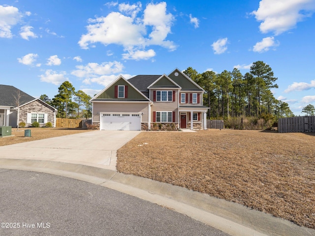 view of front of house featuring a garage, concrete driveway, stone siding, fence, and board and batten siding