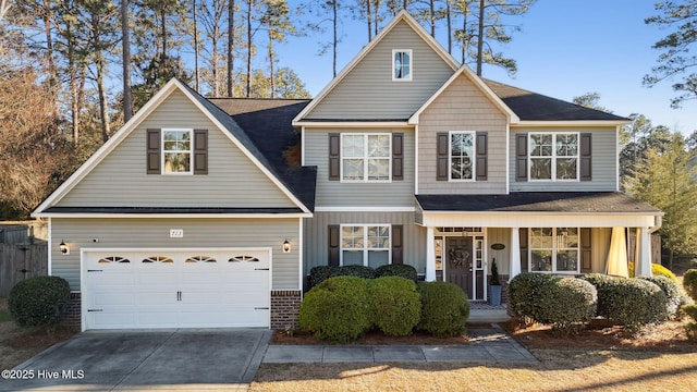 view of front of property featuring a porch, concrete driveway, brick siding, and an attached garage