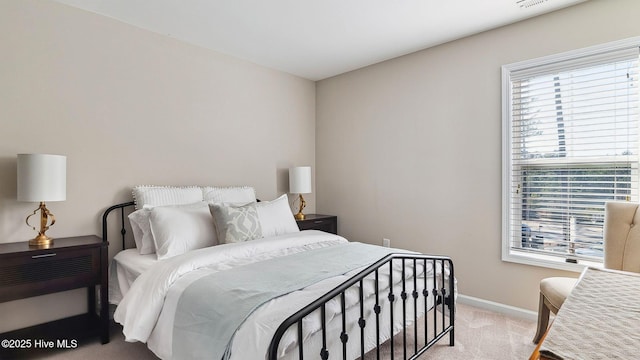 bedroom featuring carpet, visible vents, and baseboards