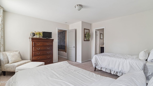 bedroom featuring light colored carpet and baseboards