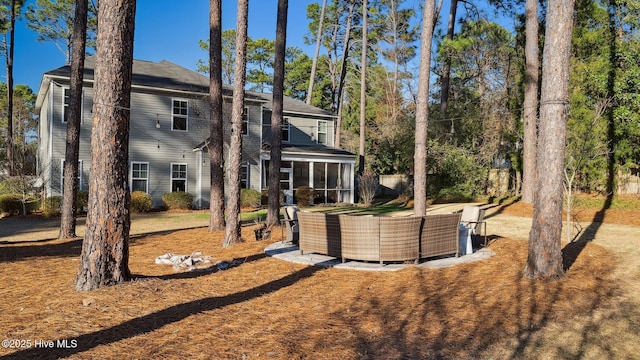 back of property featuring a sunroom