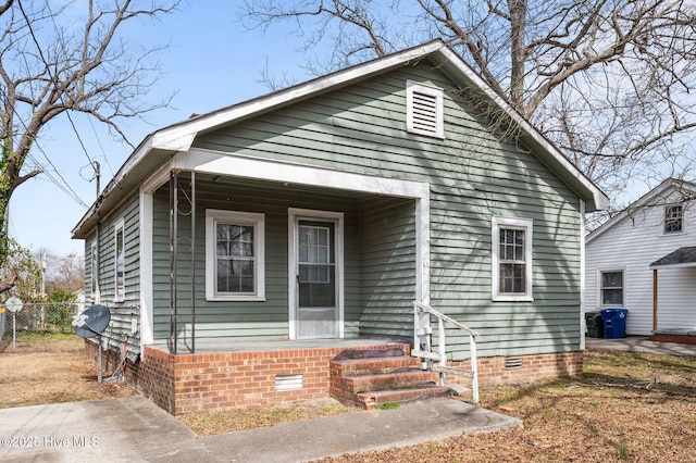 bungalow-style house with crawl space and fence