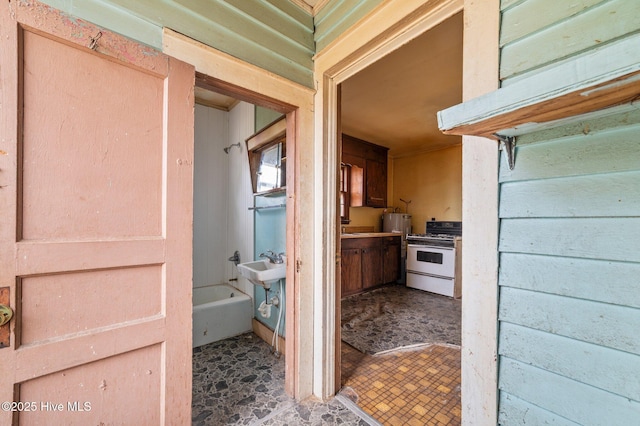 bathroom with a sink and a tub