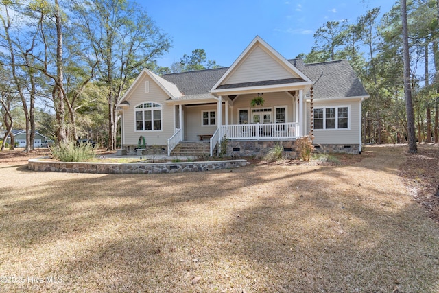 view of front of house with crawl space, a shingled roof, and a porch