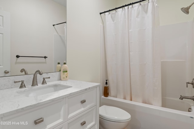 full bath featuring shower / bathtub combination with curtain, toilet, and vanity