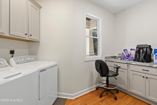 laundry room featuring baseboards, separate washer and dryer, cabinet space, and light wood-style floors