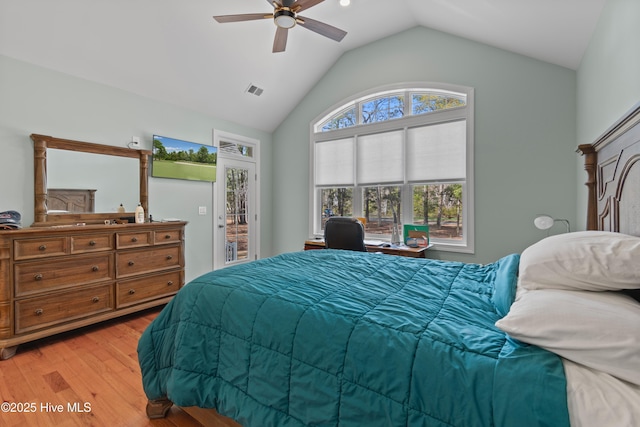 bedroom featuring light wood finished floors, visible vents, vaulted ceiling, ceiling fan, and access to outside