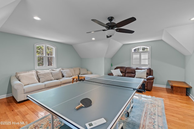 game room with lofted ceiling, a healthy amount of sunlight, and light wood-style flooring