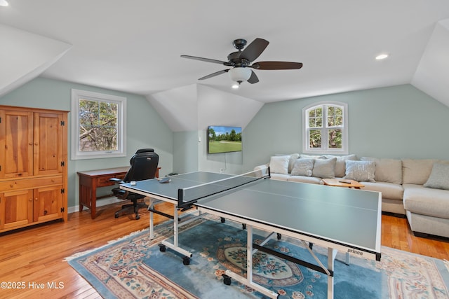 game room with vaulted ceiling, light wood-style flooring, and ceiling fan