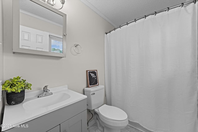 bathroom with a textured ceiling, vanity, toilet, and crown molding