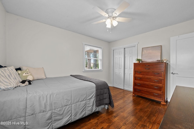 bedroom with a closet, wood-type flooring, and ceiling fan