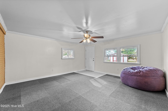 sitting room featuring ceiling fan, ornamental molding, carpet, and baseboards