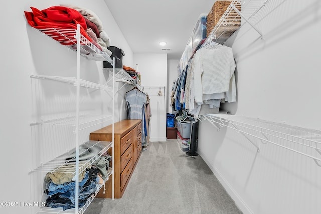 walk in closet with carpet flooring and visible vents