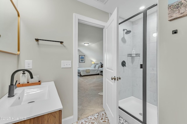 ensuite bathroom featuring ensuite bath, a stall shower, and vanity