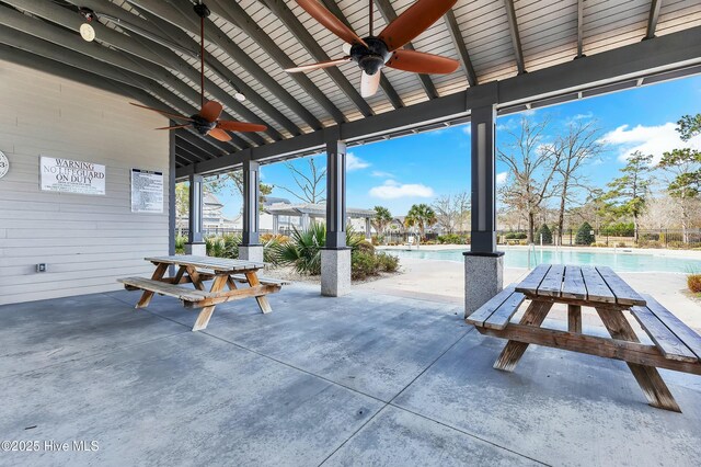 view of patio / terrace featuring a community pool and a ceiling fan