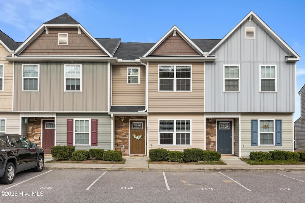 view of property featuring stone siding