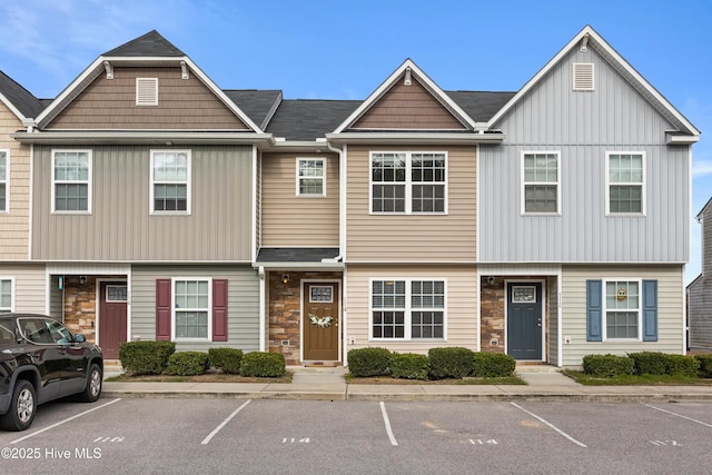 view of property featuring stone siding