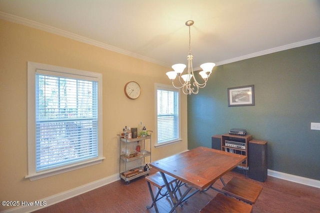 dining area with wood finished floors, baseboards, and ornamental molding