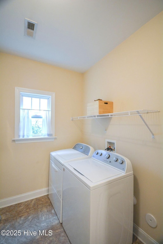 laundry area featuring independent washer and dryer, laundry area, baseboards, and visible vents