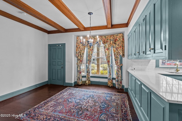 dining space with a notable chandelier, baseboards, dark wood-type flooring, and beam ceiling